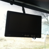 Windshield mounted visual screen